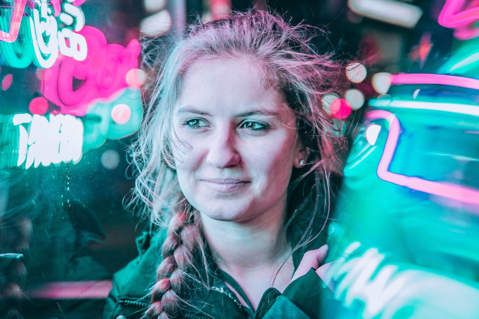 woman standing beside neon lights